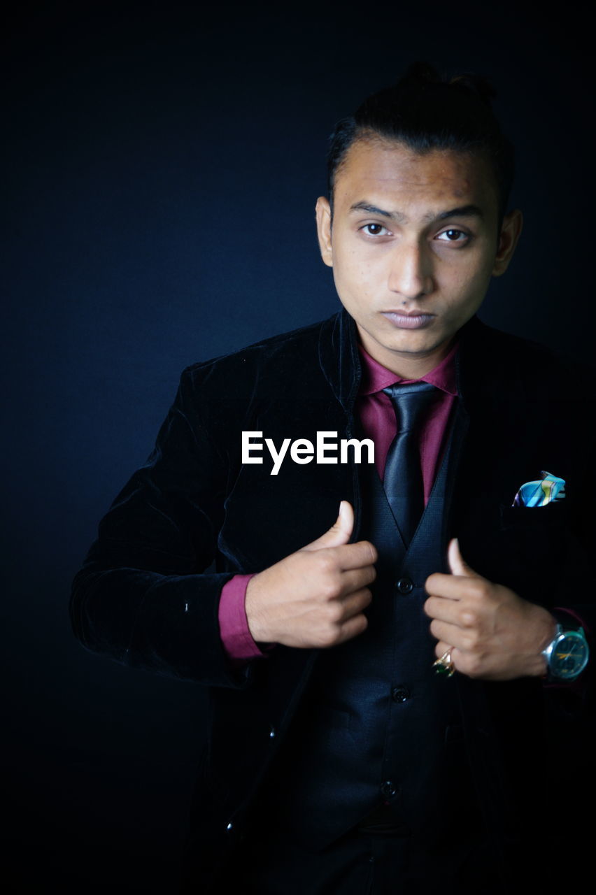 adult, one person, sports, indoors, portrait, men, studio shot, black background, lifestyles, athlete, strength, looking at camera, exercising, muscular build, sports training, sports clothing, lying down, modern dance, person, copy space, young adult