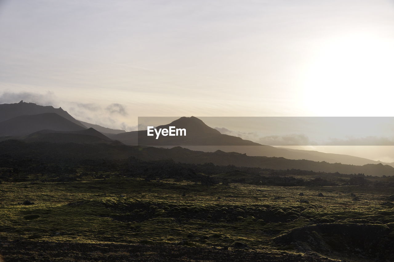 Scenic view of landscape against sky during sunset