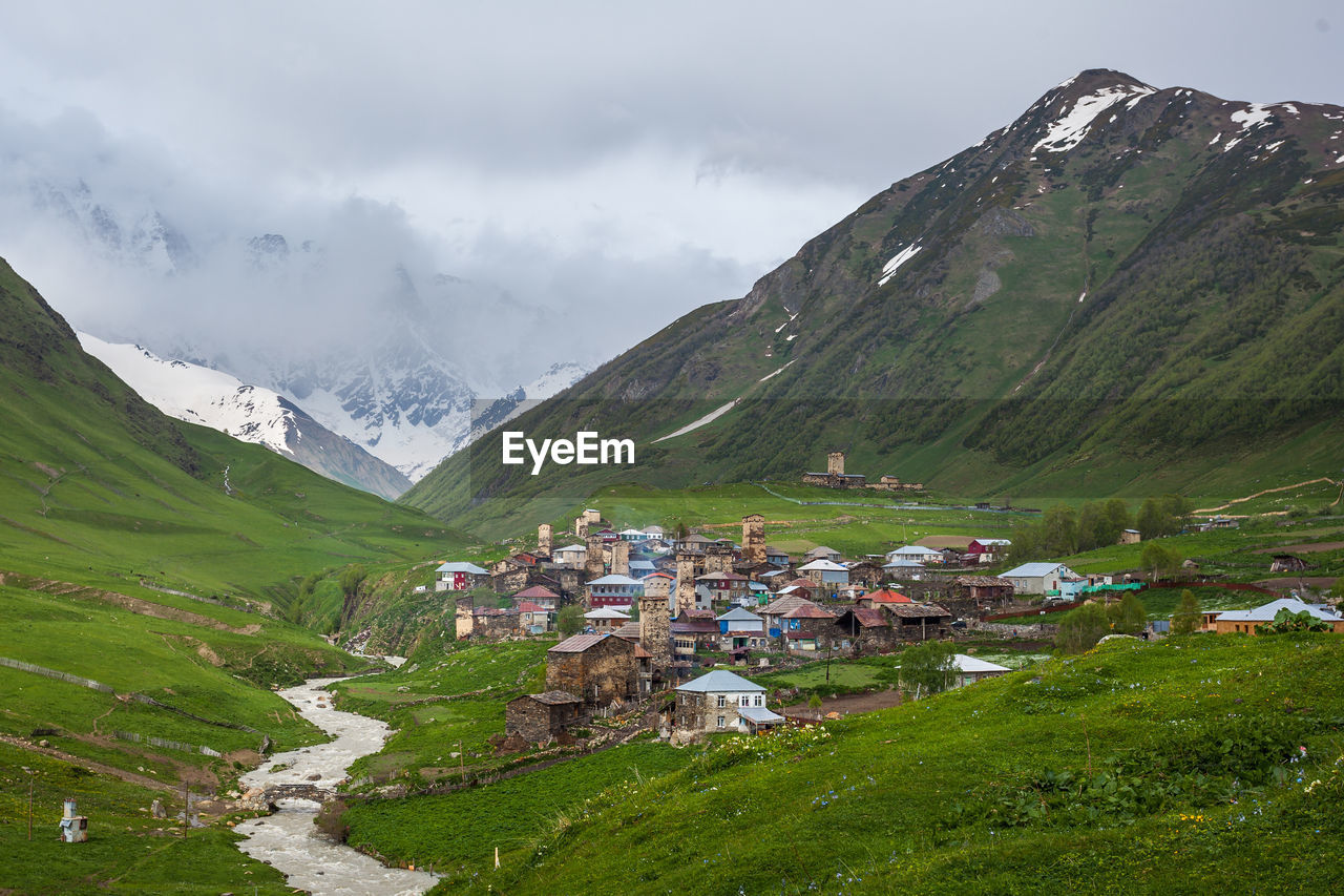 SCENIC VIEW OF MOUNTAINS AGAINST SKY DURING SUNNY DAY