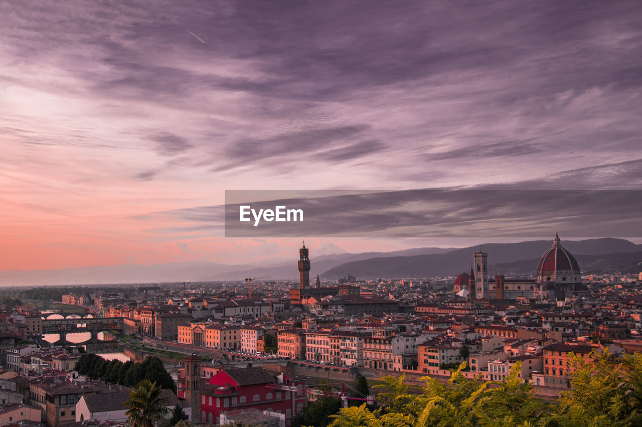 High angle view of city buildings during sunset