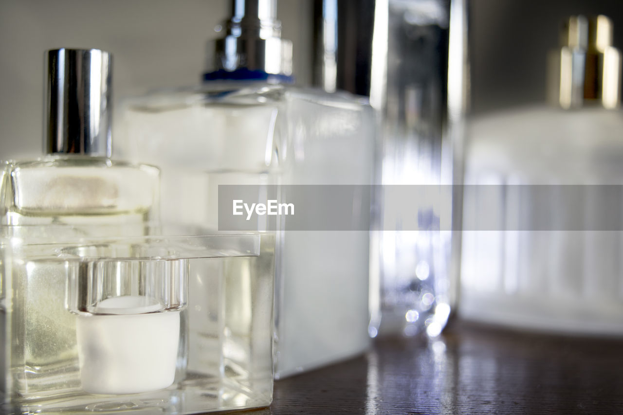 CLOSE-UP OF BOTTLES IN KITCHEN