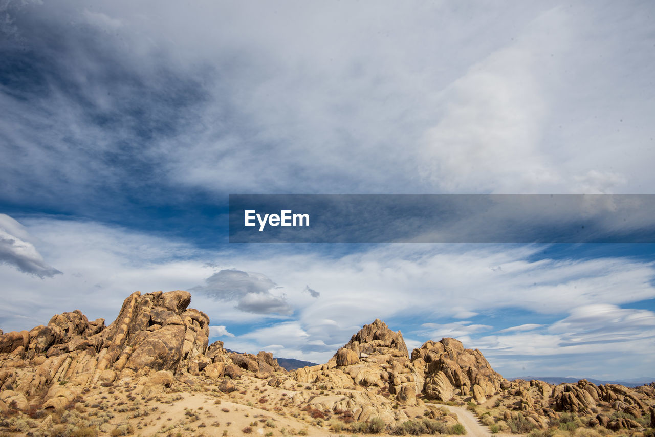 Low angle view of rock formations against sky