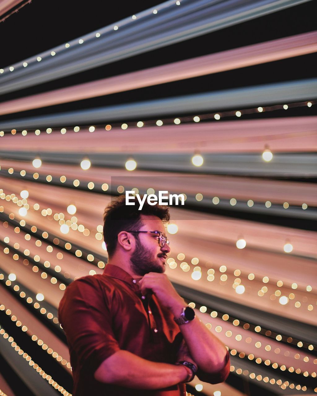 Full length of young man looking away at night