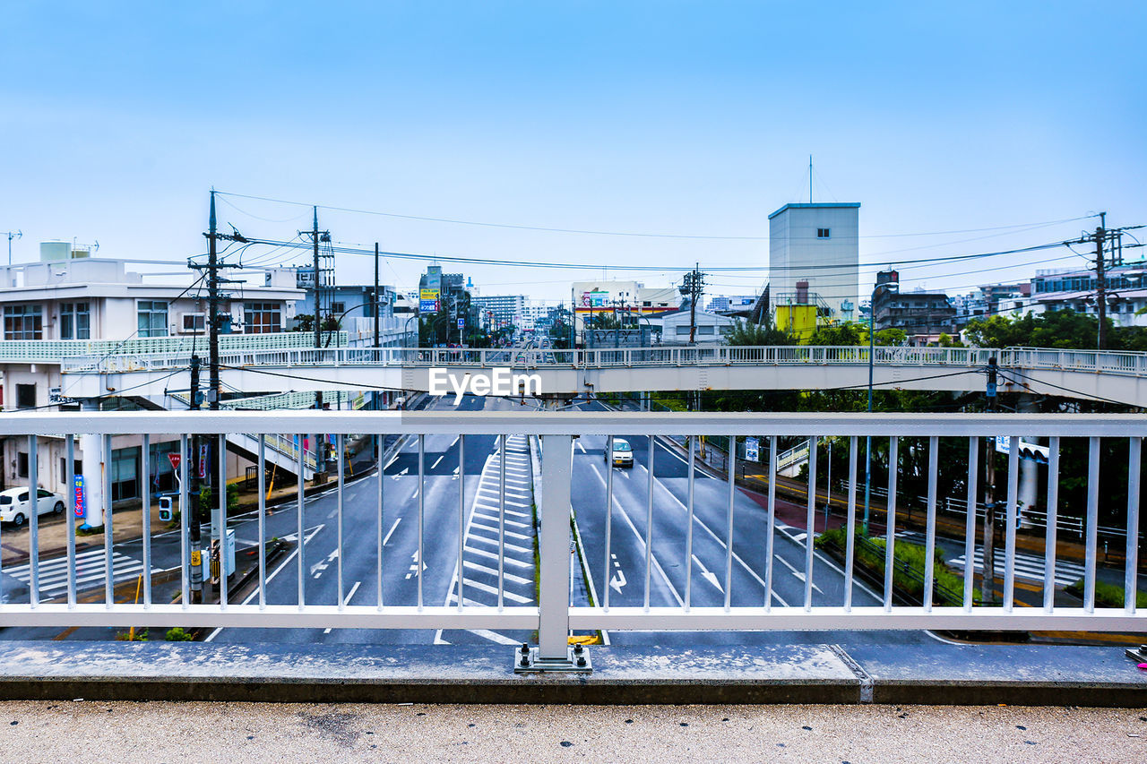 Bridge against sky in city