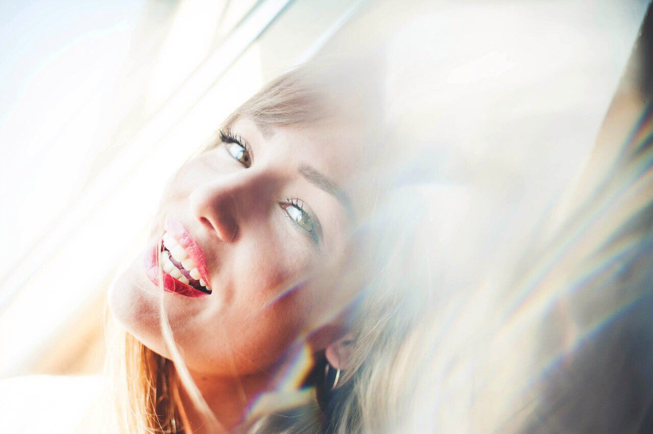 YOUNG WOMAN LOOKING DOWN