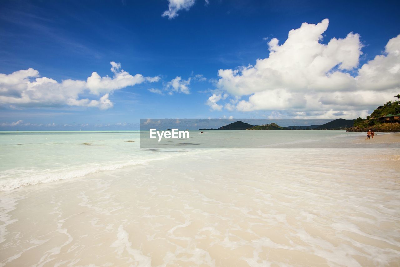 Scenic view of beach at antigua against sky