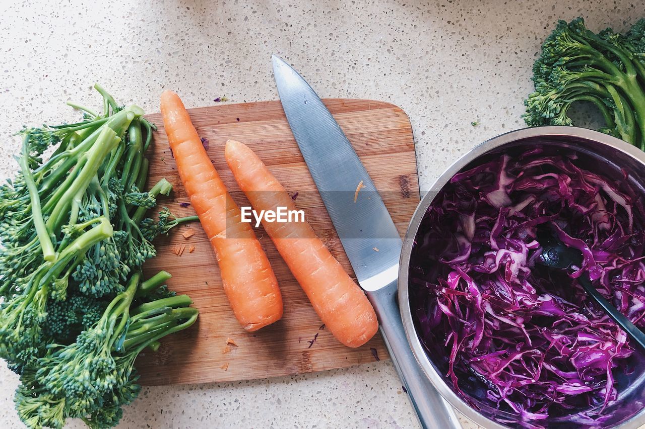 Directly above shot of vegetables on cutting board and bowl