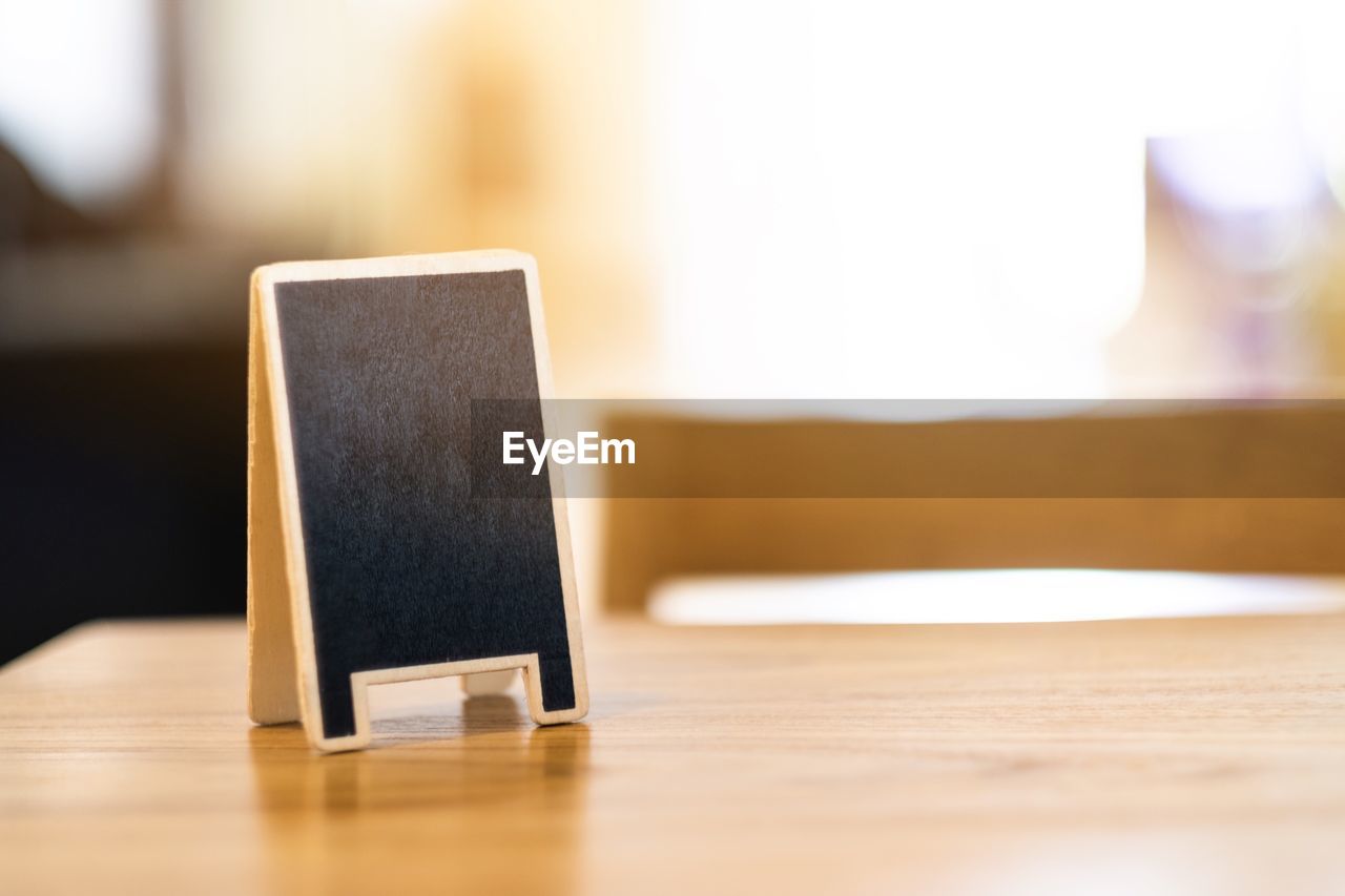 CLOSE-UP OF LAPTOP ON TABLE IN BATHROOM