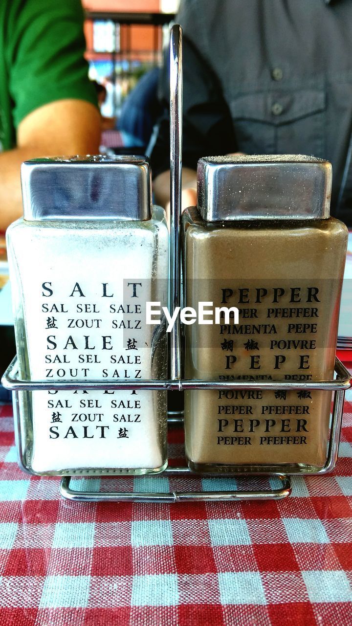 Salt and pepper shakers on table