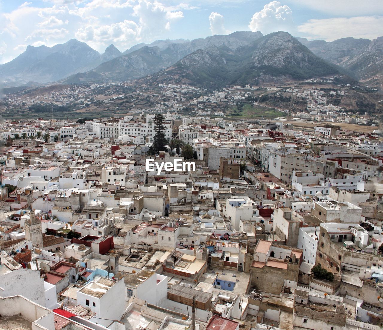 High angle view of townscape against mountains