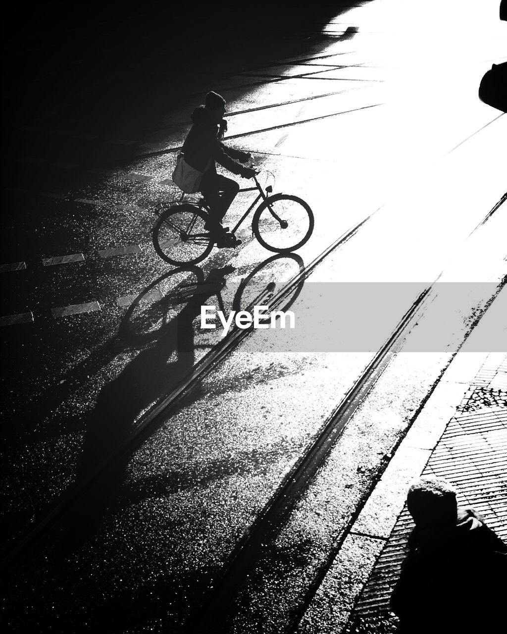 High angle view of man riding bicycle on tramway