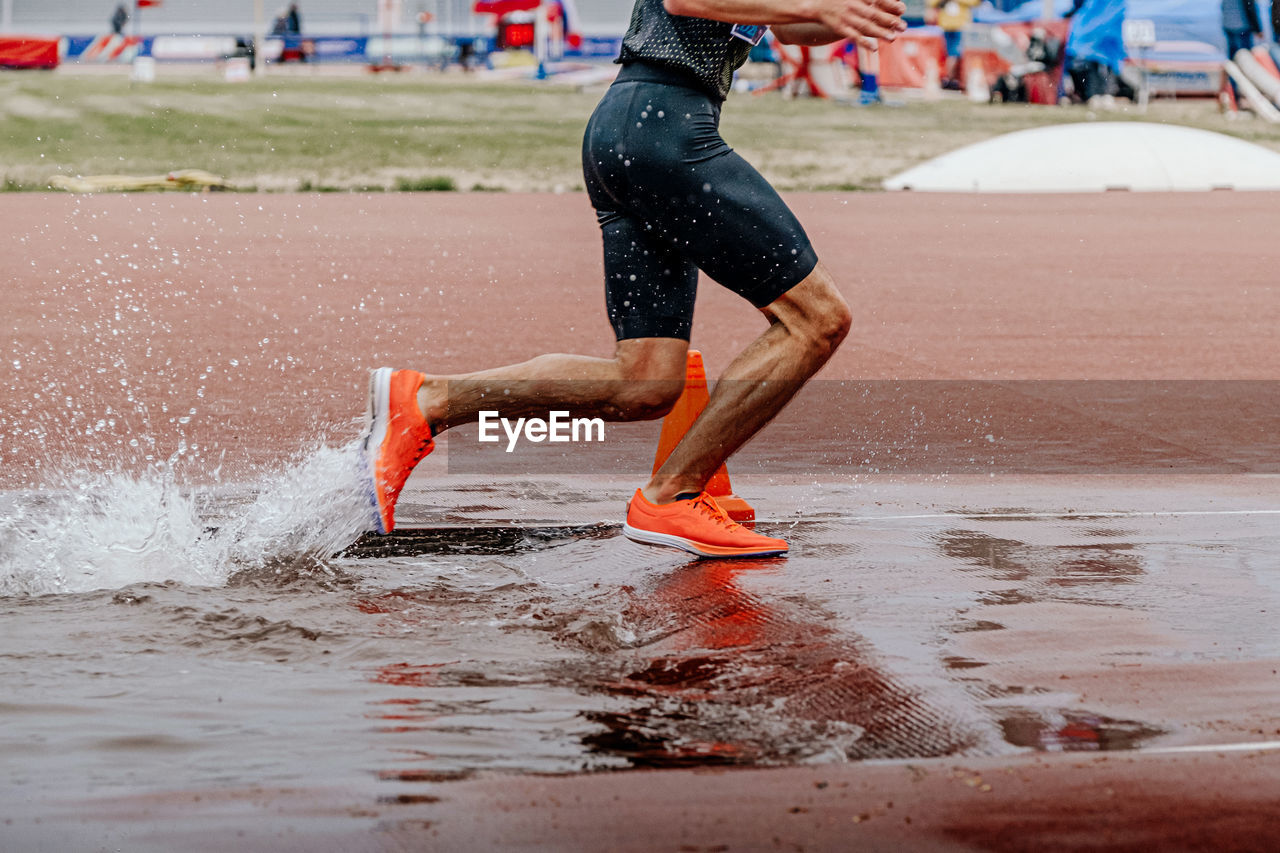 Legs runner athlete run steeplechase in athletics
