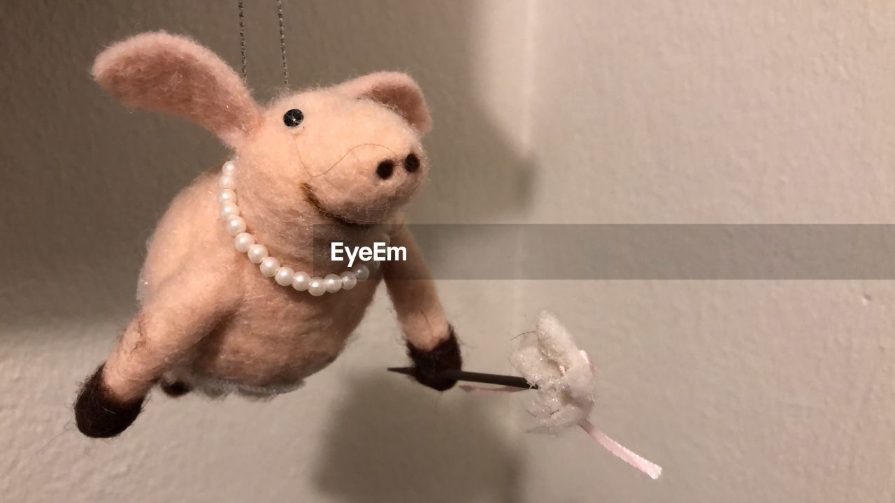 HIGH ANGLE VIEW OF STUFFED TOY IN MOUTH WALL