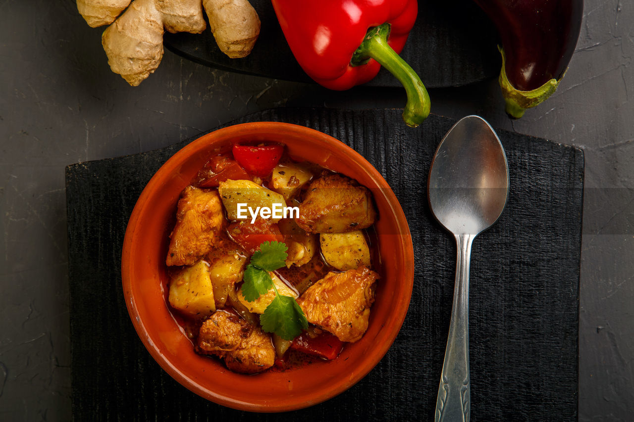 Food for suhoor in ramadan lamb stew with potatoes vegetables on a gray background. horizontal photo