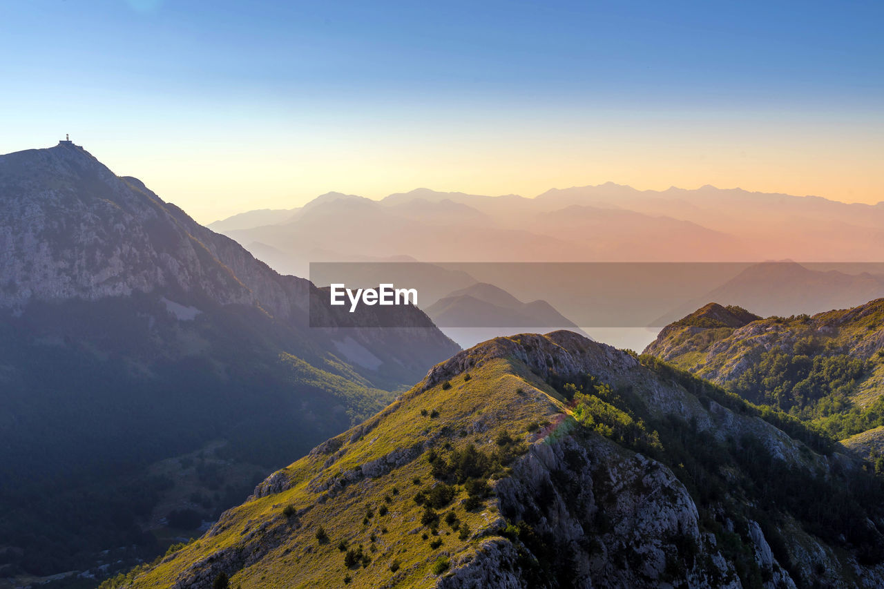 Scenic view of mountains against sky during sunset