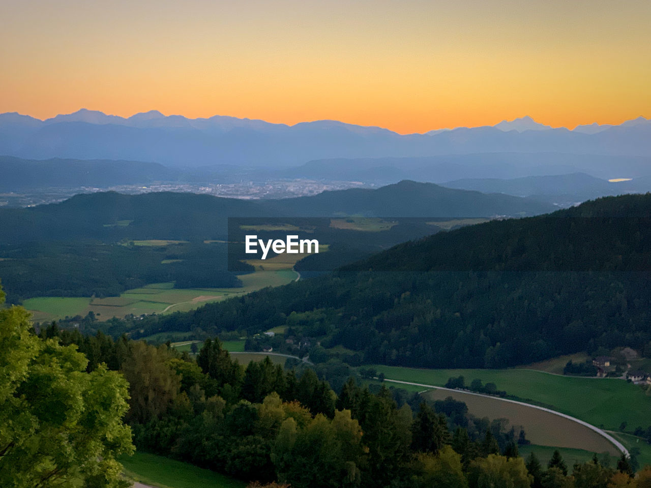 Scenic view of mountains against sky during sunset