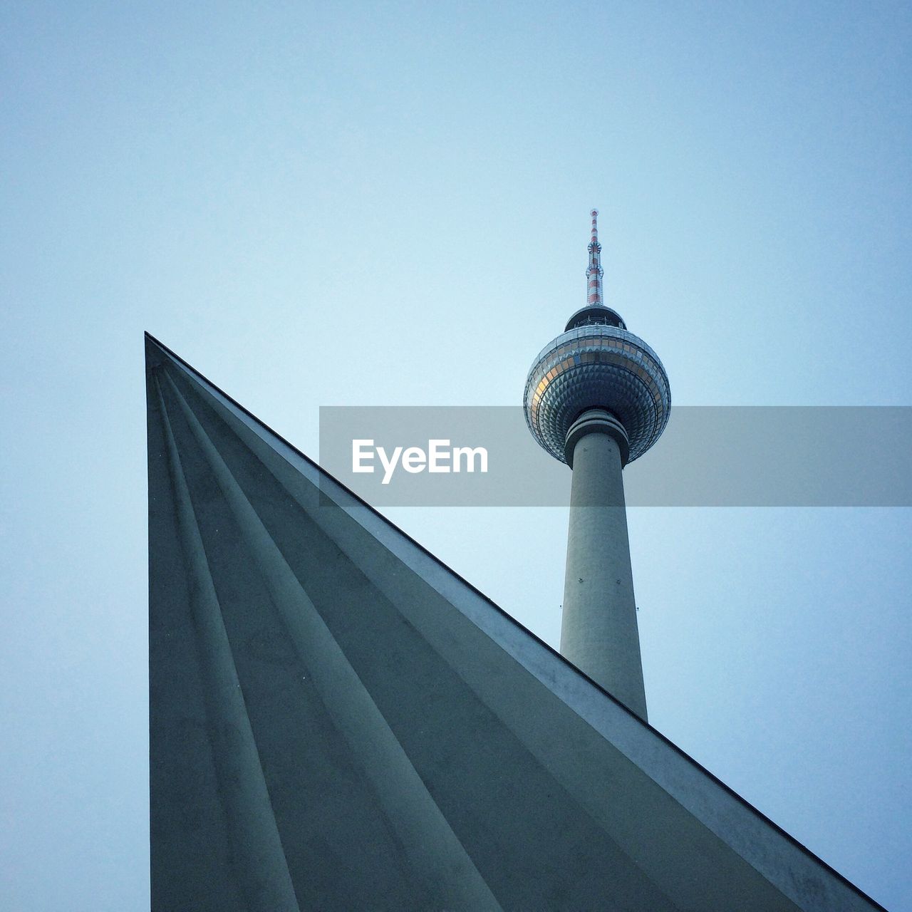 Low angle view of communications tower against clear sky