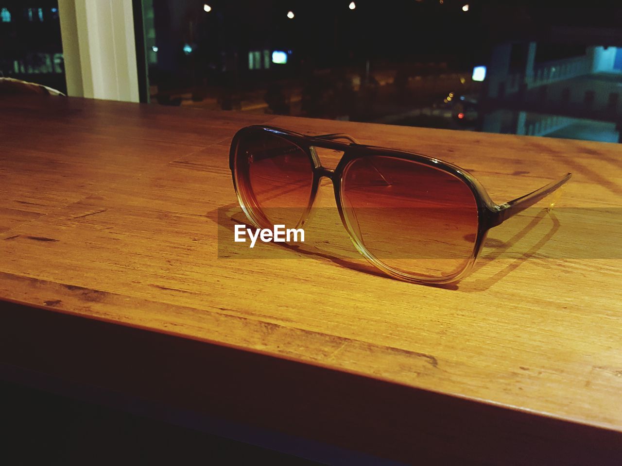 Close-up of sunglasses on table