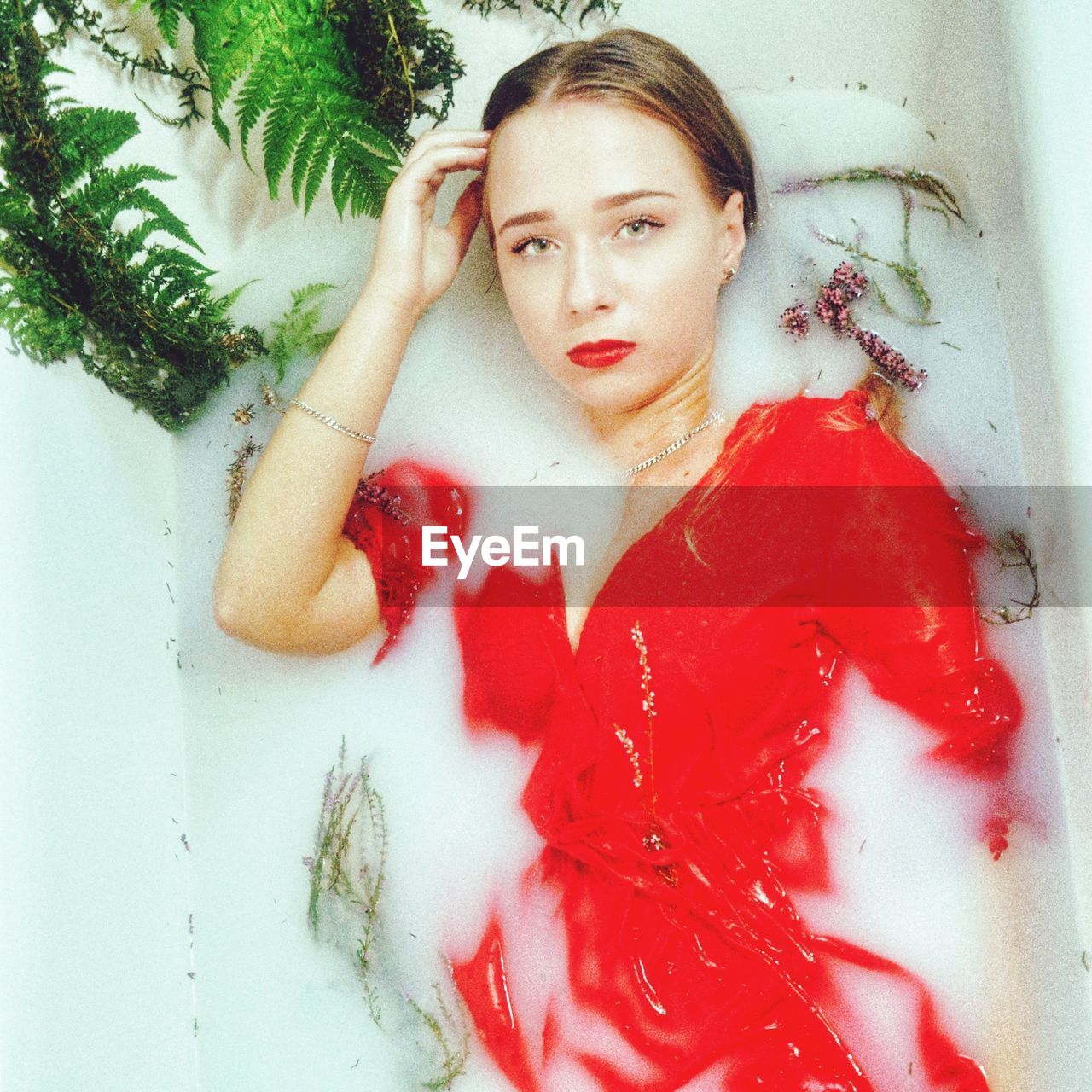 Portrait of teenage girl in bathtub