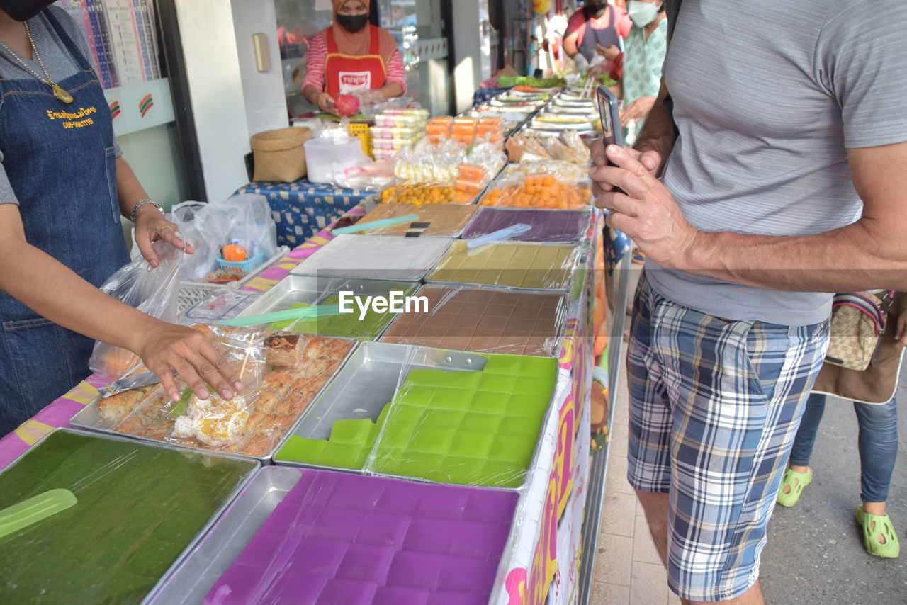 Buying thai sweets at hat yai vendor 