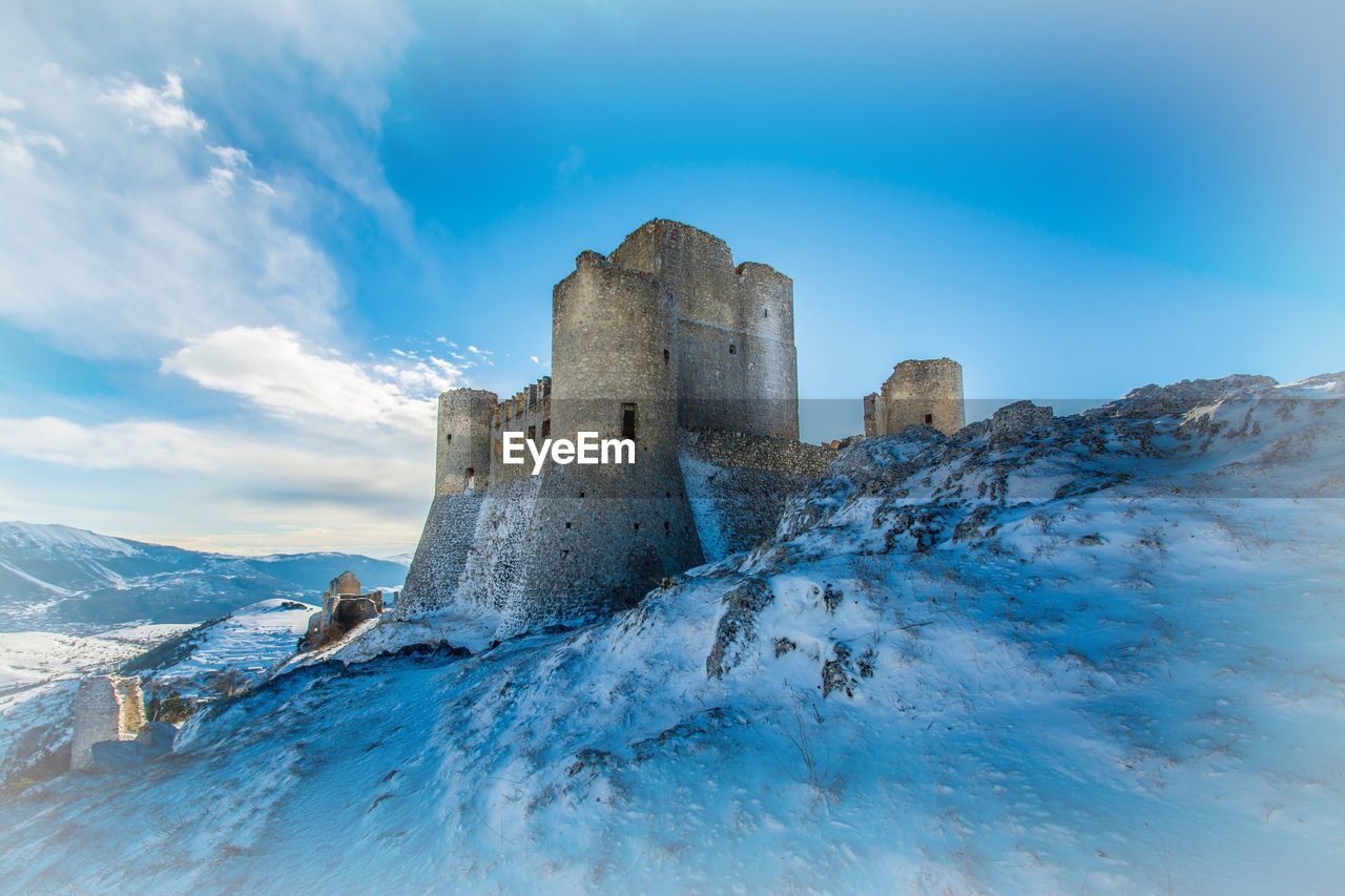 LOW ANGLE VIEW OF OLD RUINS IN WINTER