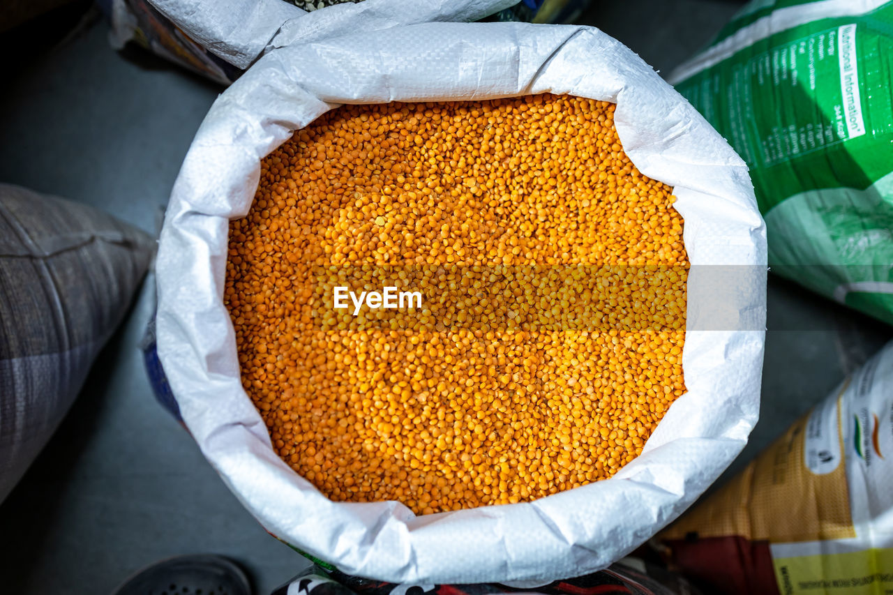 Red lentil for sale at retail shop from top angle at day