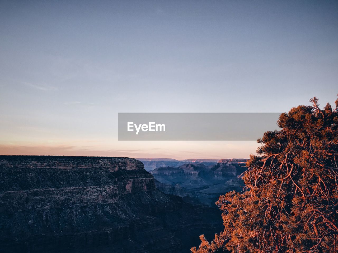 Scenic view of landscape against sky during sunset