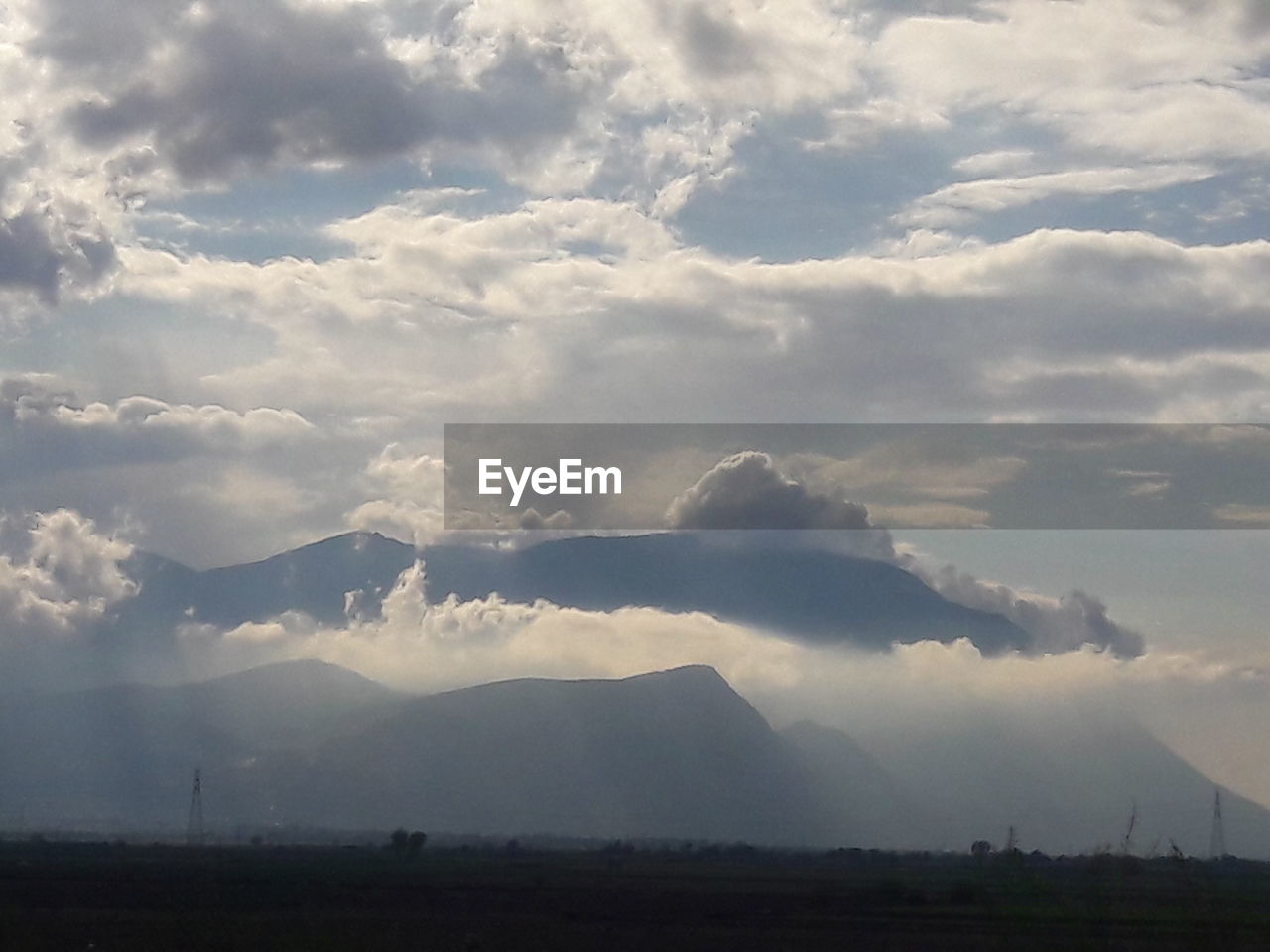 STORM CLOUDS OVER LAND