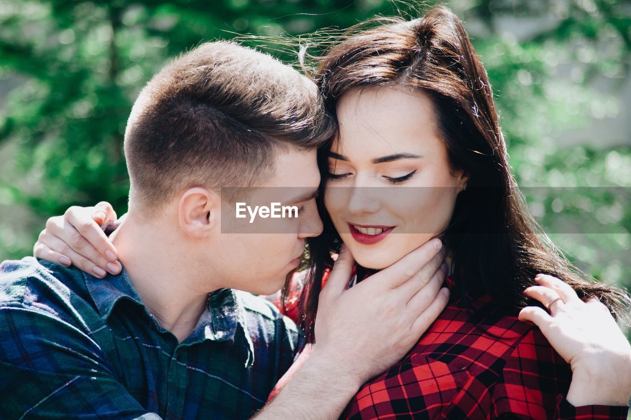 Loving young couple in forest