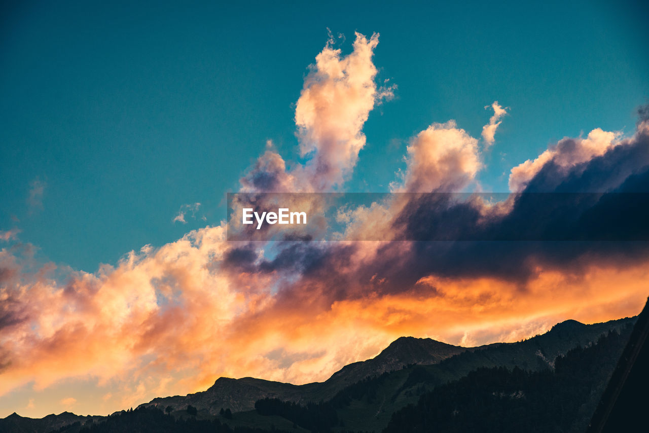 Low angle view of dramatic sky during sunset