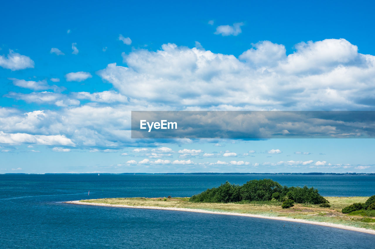 Scenic view of sea against blue sky