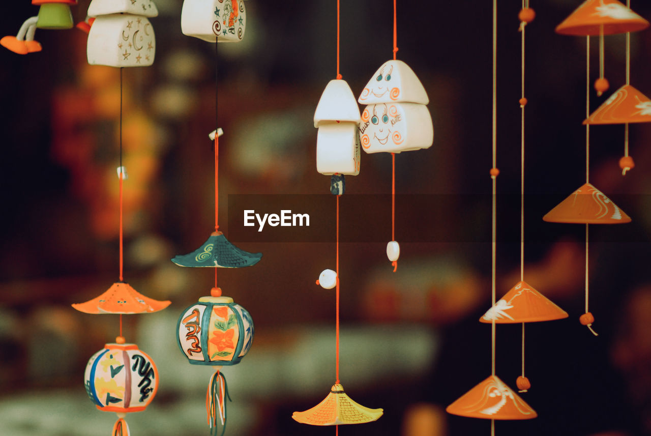 Close-up of decorations hanging for sale