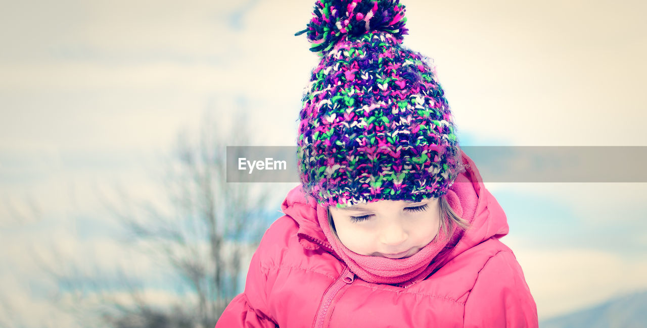 Close-up portrait of girl in winter