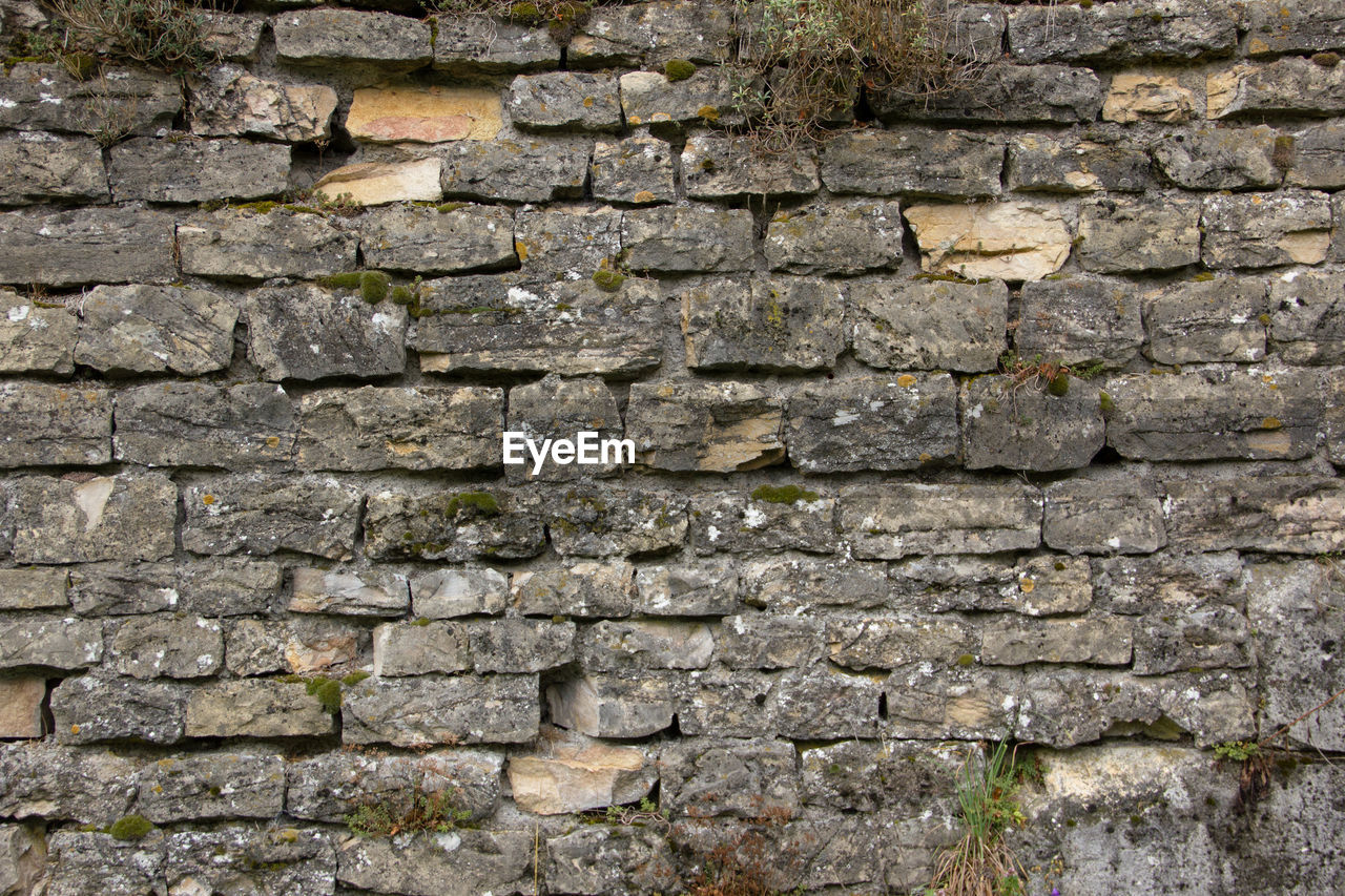 wall, backgrounds, architecture, solid, textured, built structure, full frame, stone material, stone wall, wall - building feature, no people, pattern, stone - object, old, brick, close-up, weathered, outdoors, brick wall, day, textured effect