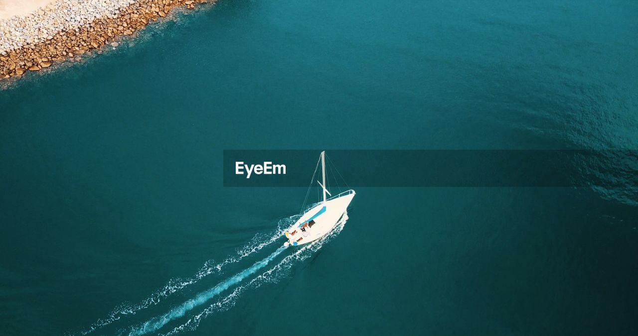 High angle view of ship sailing in sea