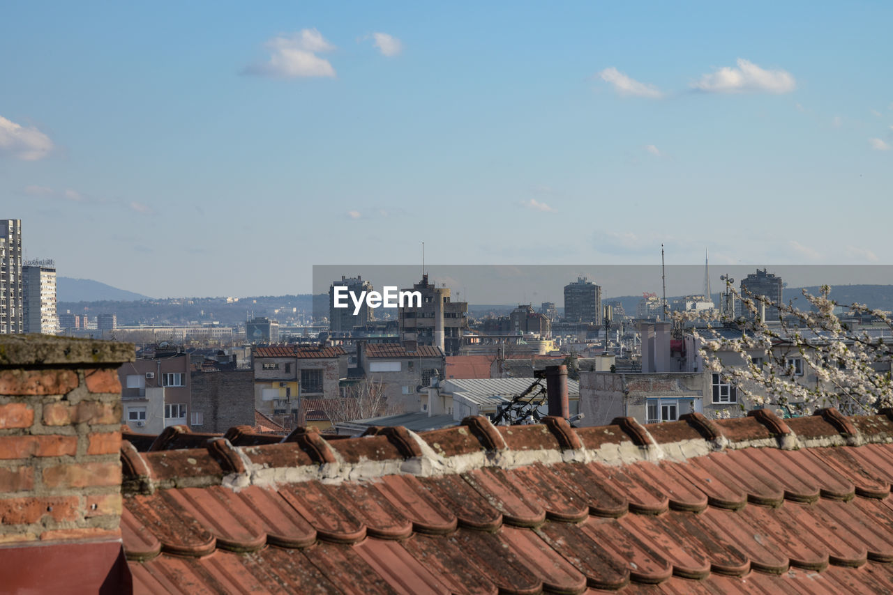 HIGH ANGLE VIEW OF CITY BUILDINGS AGAINST SKY