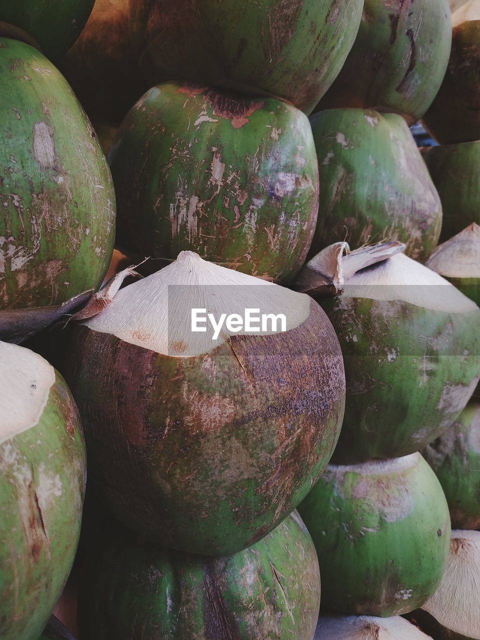 Full frame shot of coconuts for sale at market stall