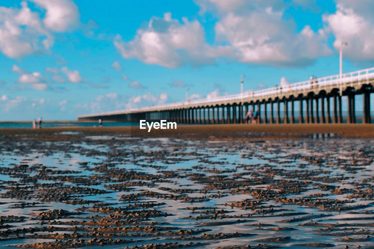 Bridge over sea against sky