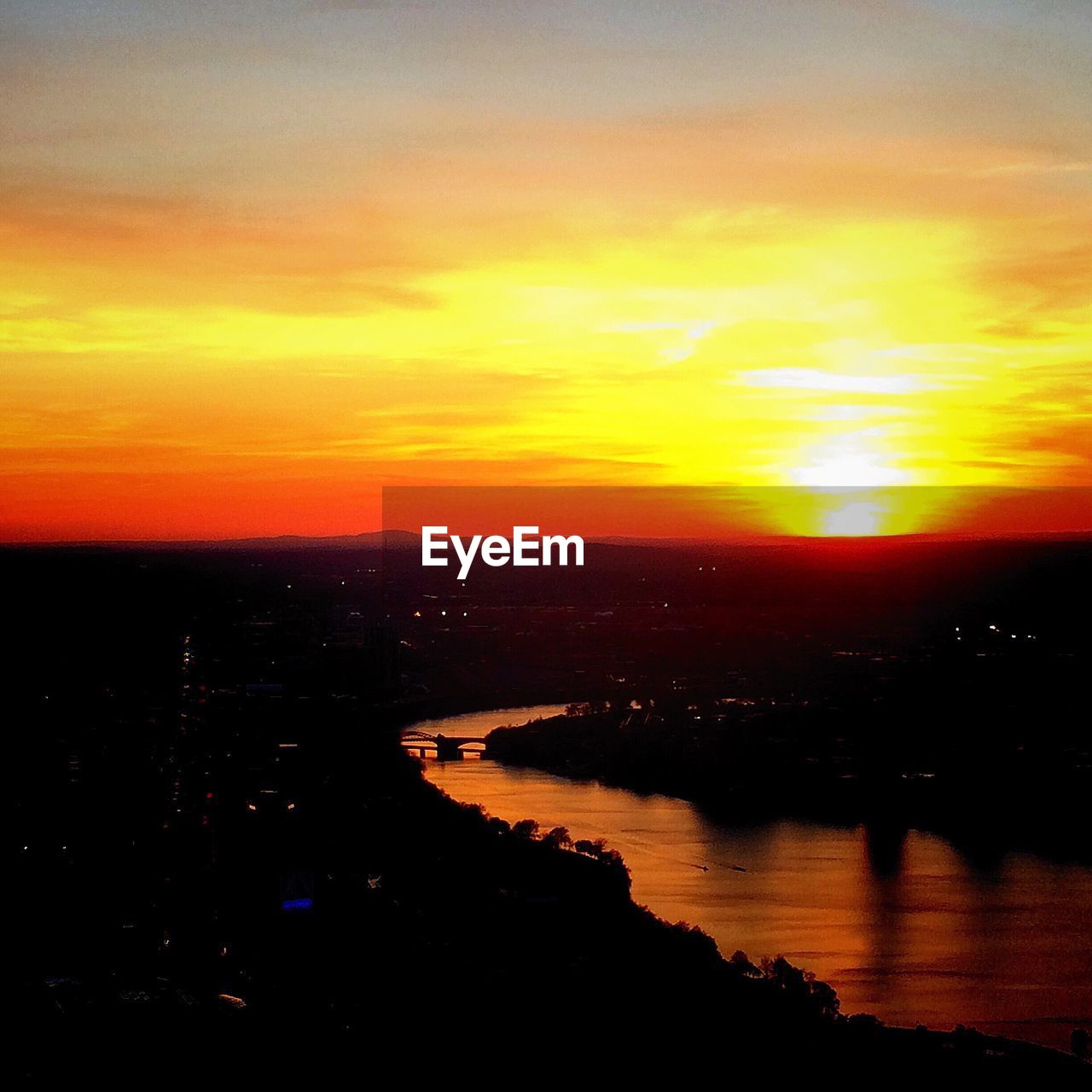 HIGH ANGLE VIEW OF RIVER DURING SUNSET