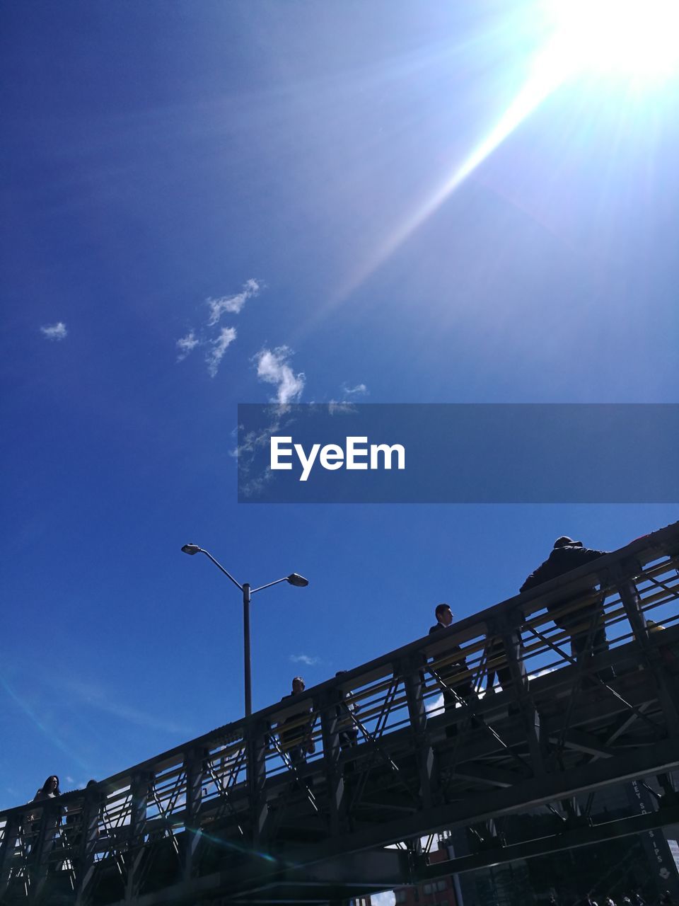 LOW ANGLE VIEW OF BUILT STRUCTURES AGAINST BLUE SKY