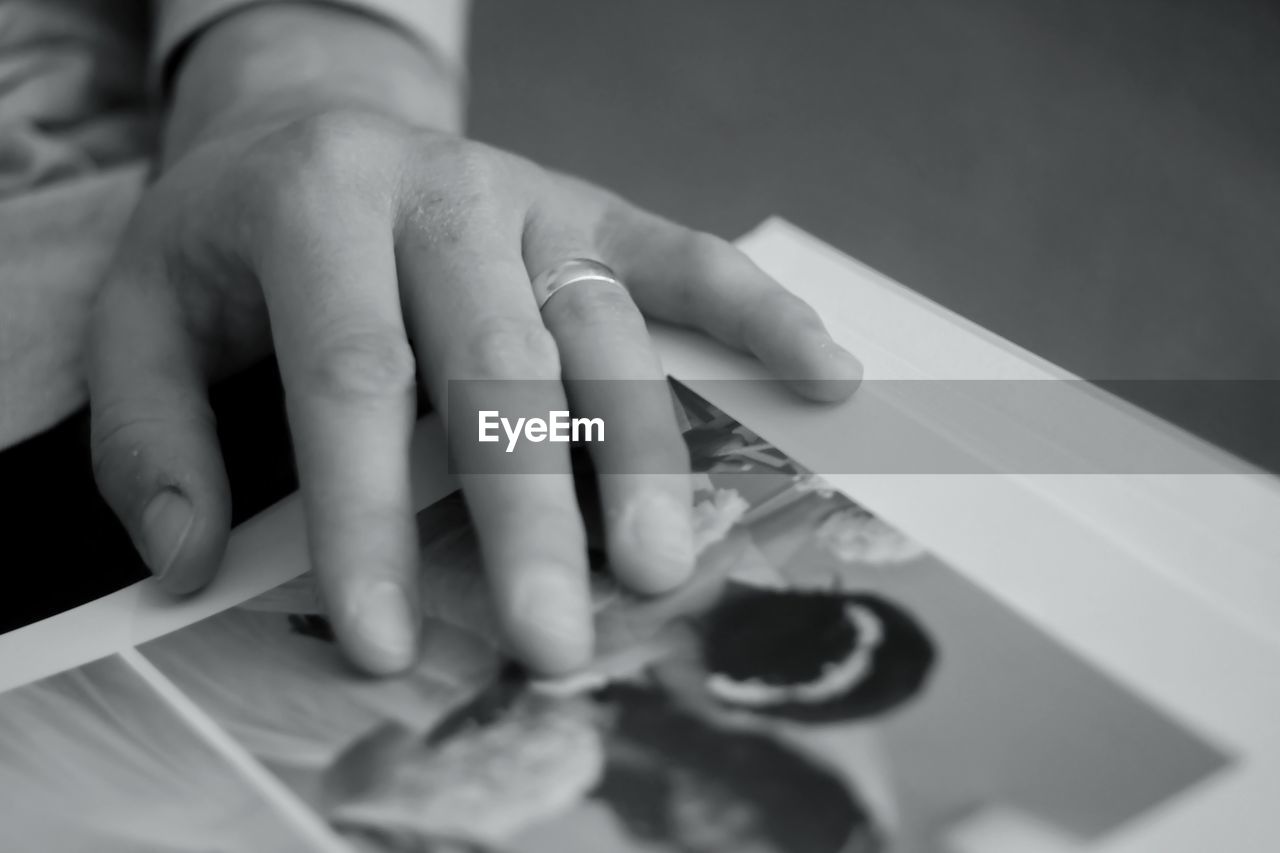 Cropped hand of person holding photograph