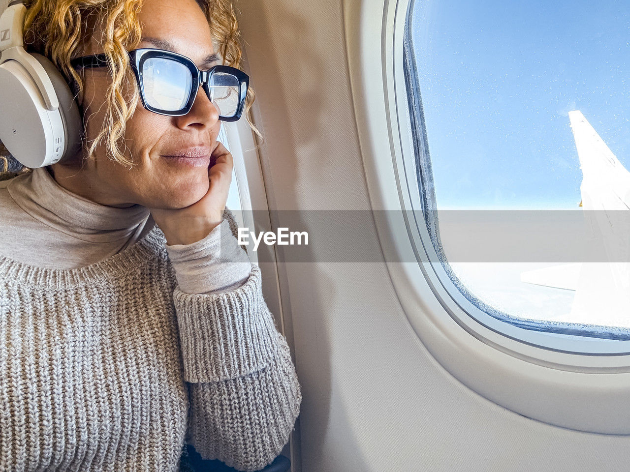 close-up of woman wearing sunglasses against sky