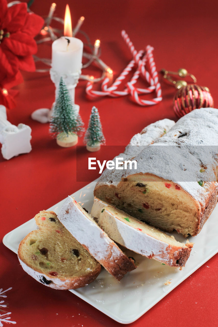 Christmas stollen on rustic background. traditional christmas festive pastry dessert from german. 