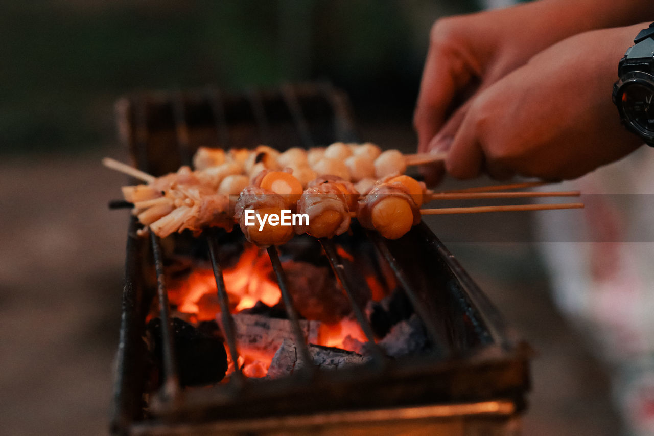 Cropped image of person preparing food