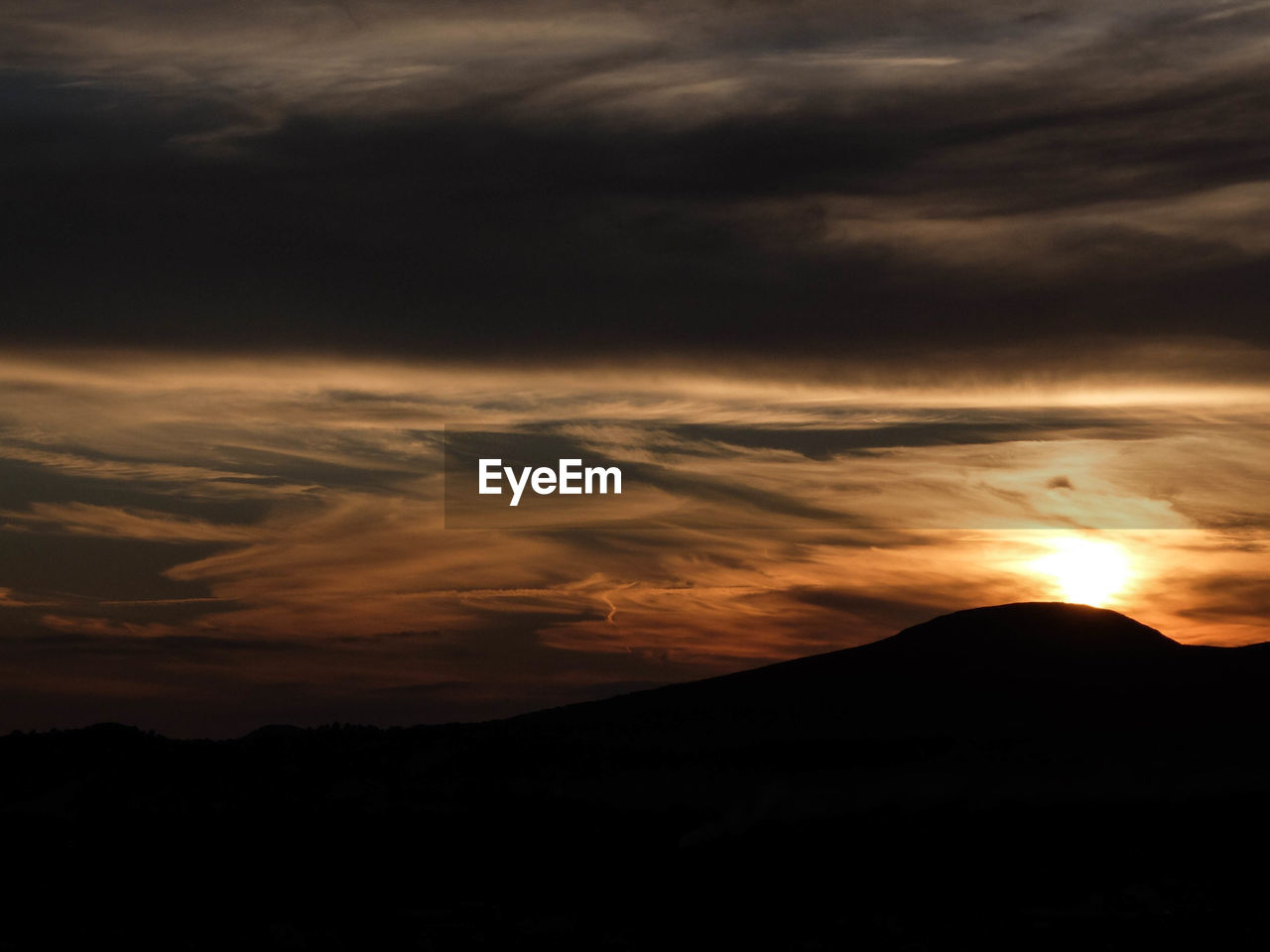 Scenic view of dramatic sky during sunset