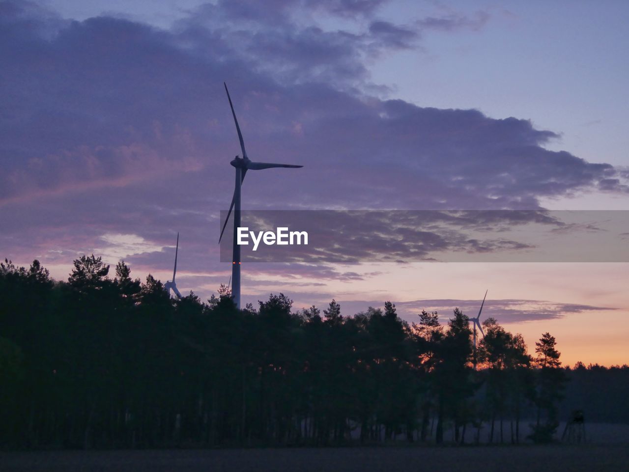 SILHOUETTE OF WIND TURBINE AGAINST SKY