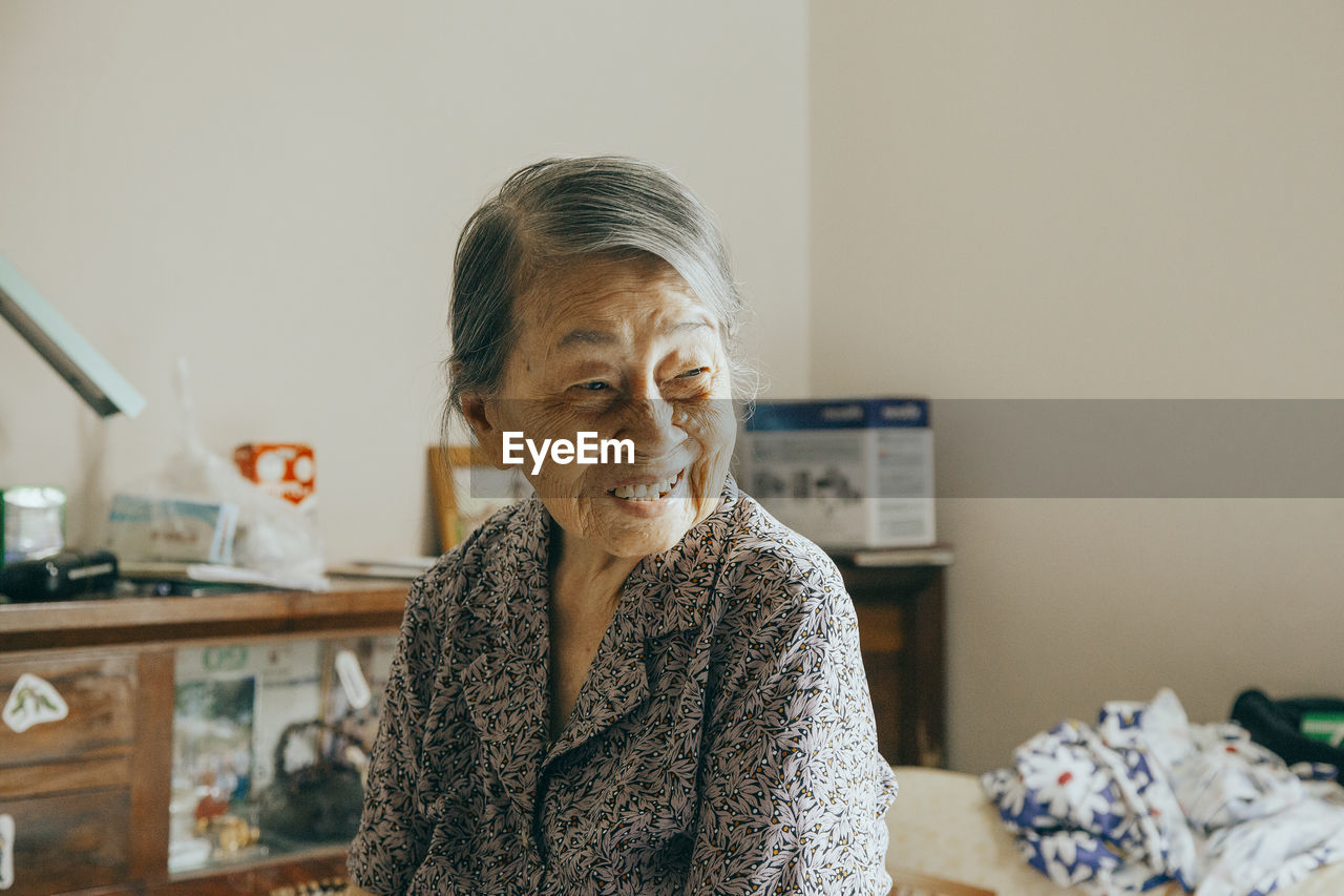 Senior woman sitting at home