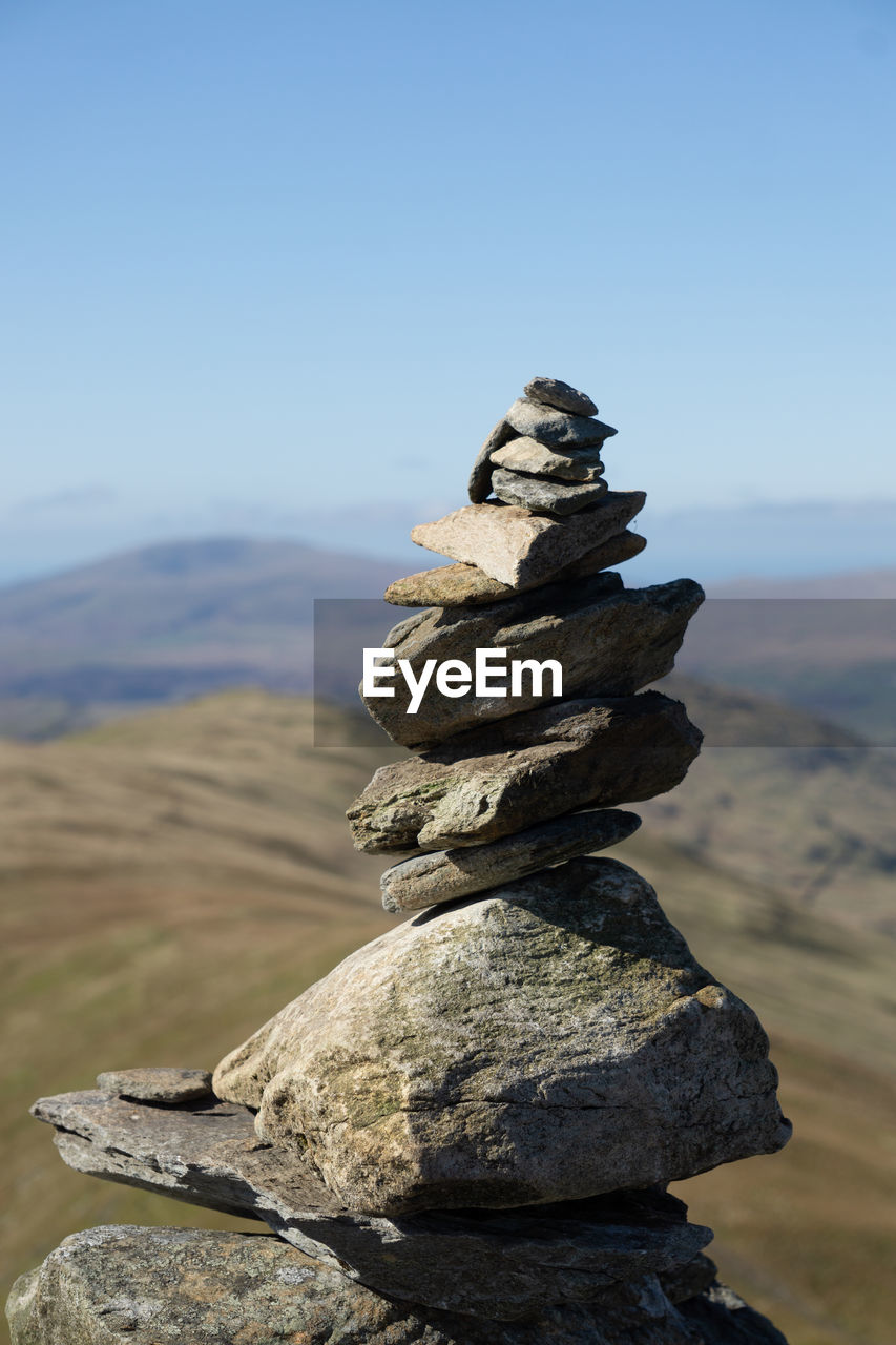 CLOSE-UP OF STONE STACK ON ROCK