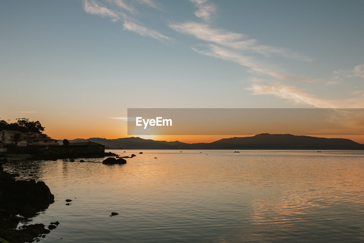 Beautiful sunrise in winter. landscape with the sea being lit by the rising sun.