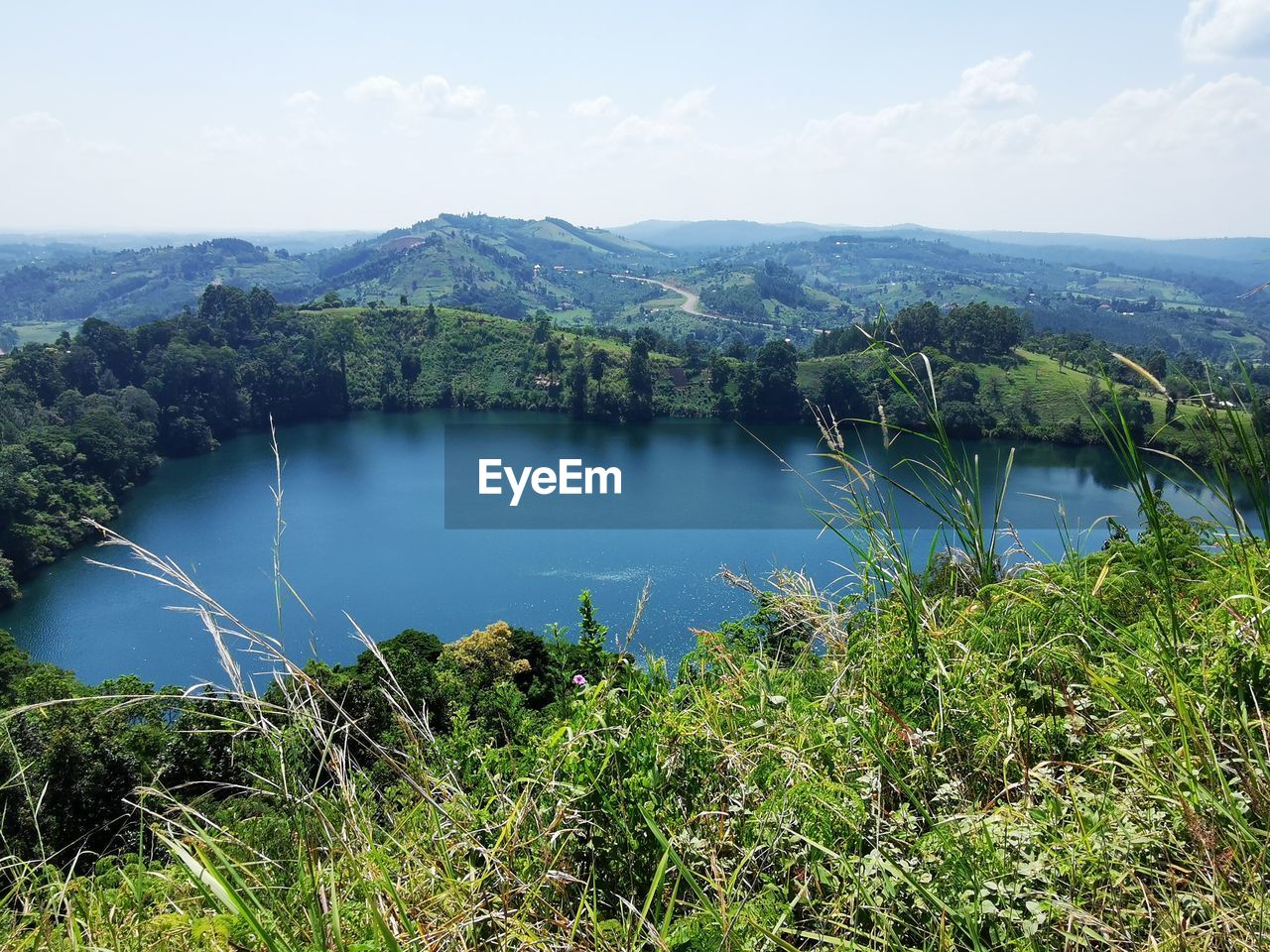 SCENIC VIEW OF LAKE AND TREES AGAINST SKY